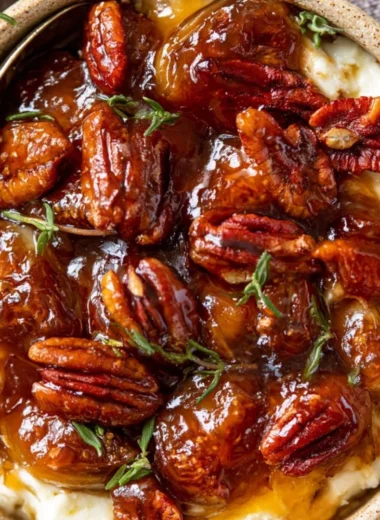 Baked feta dip topped with fig jam and pecans served with bread