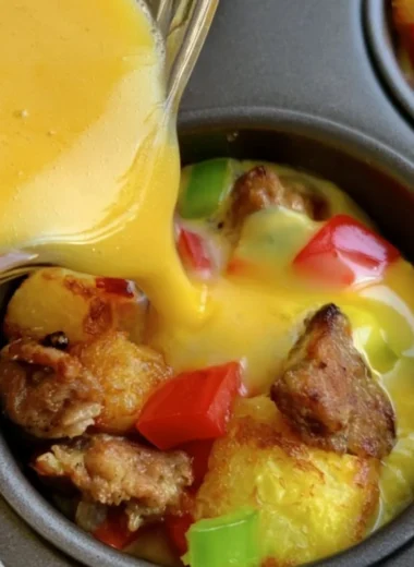 Mini breakfast omelets on a plate, garnished and ready to eat.