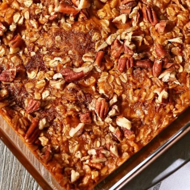 Delicious Pumpkin Pecan Baked Oatmeal served in a bowl with pecans on top